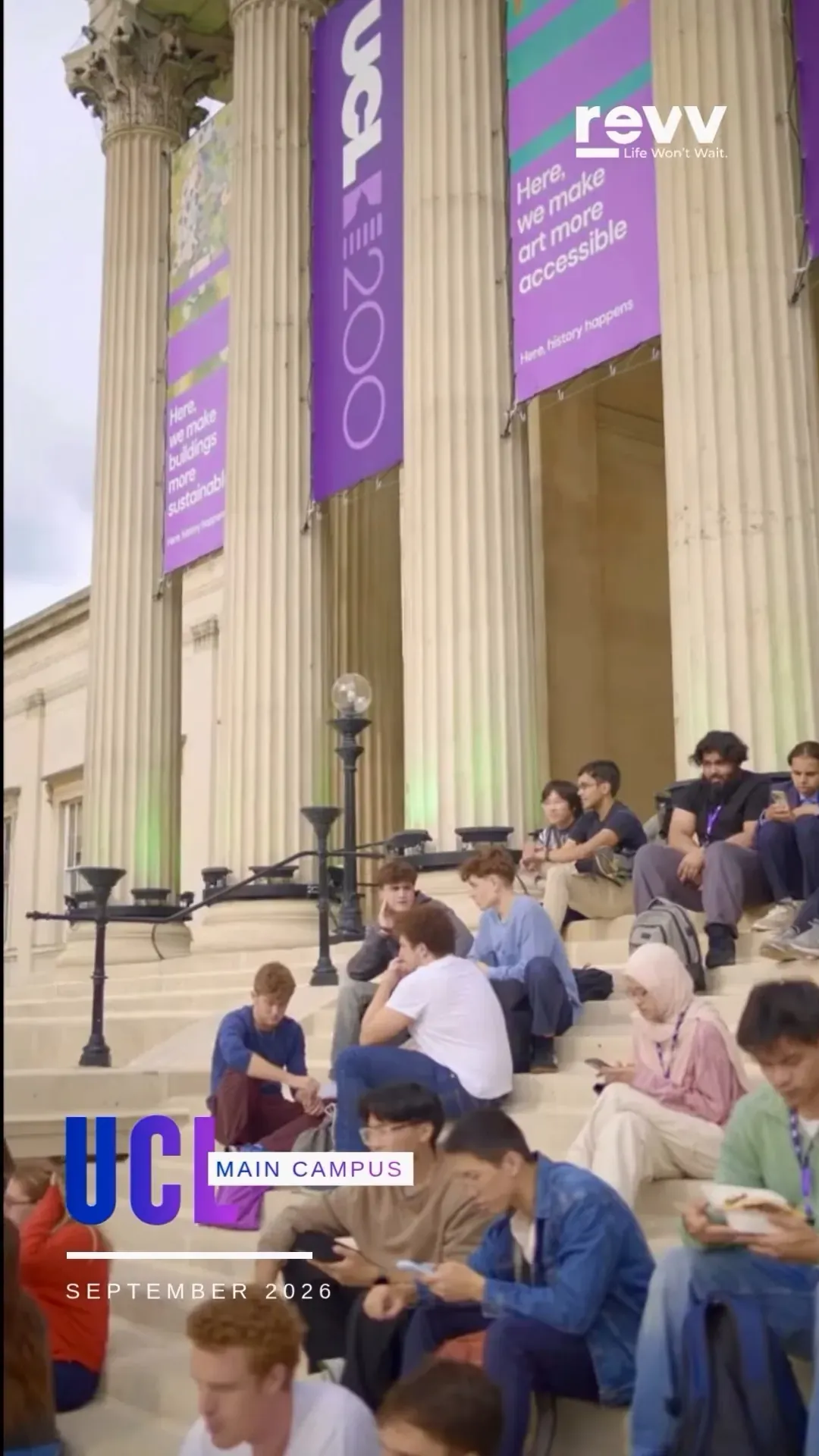 Students sitting on the portico steps of the Wilkins Building under UCL 200 banners.