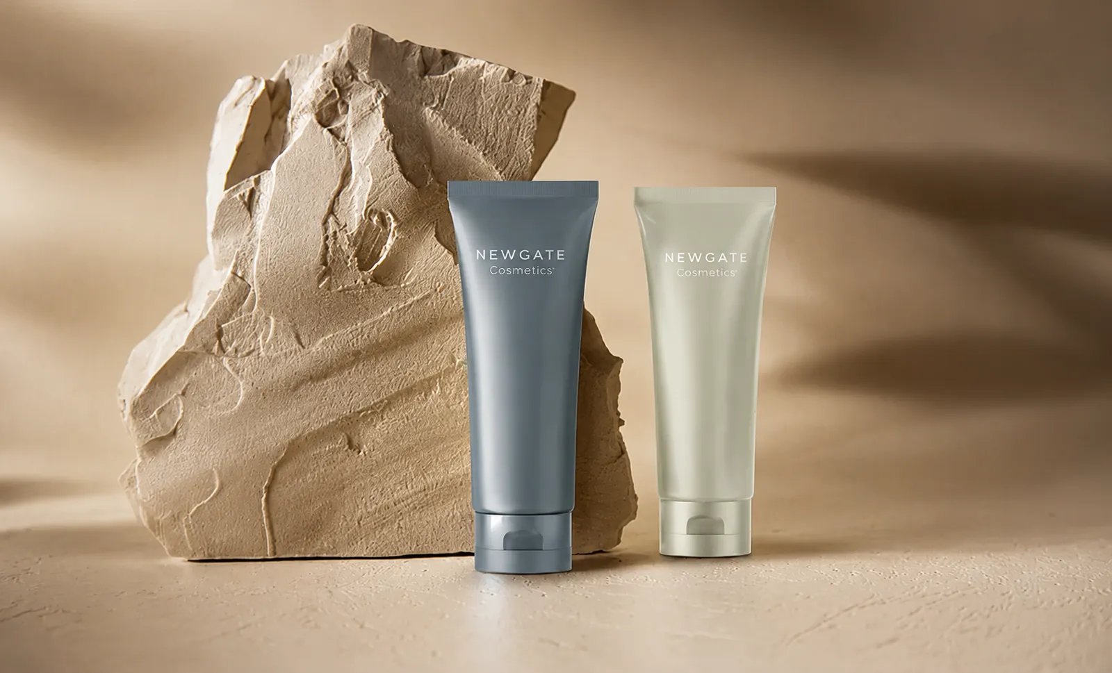 A single cosmetics tube on a pale studio surface